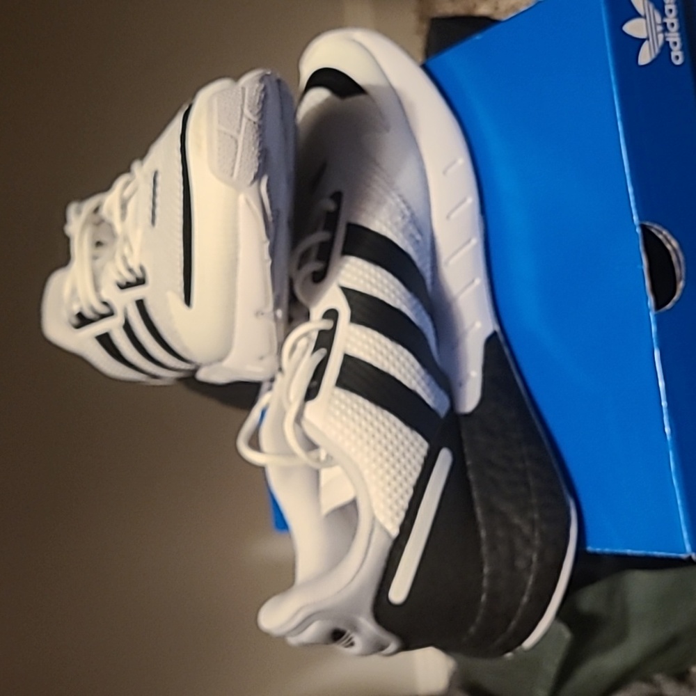 Black and white Adidas sneakers